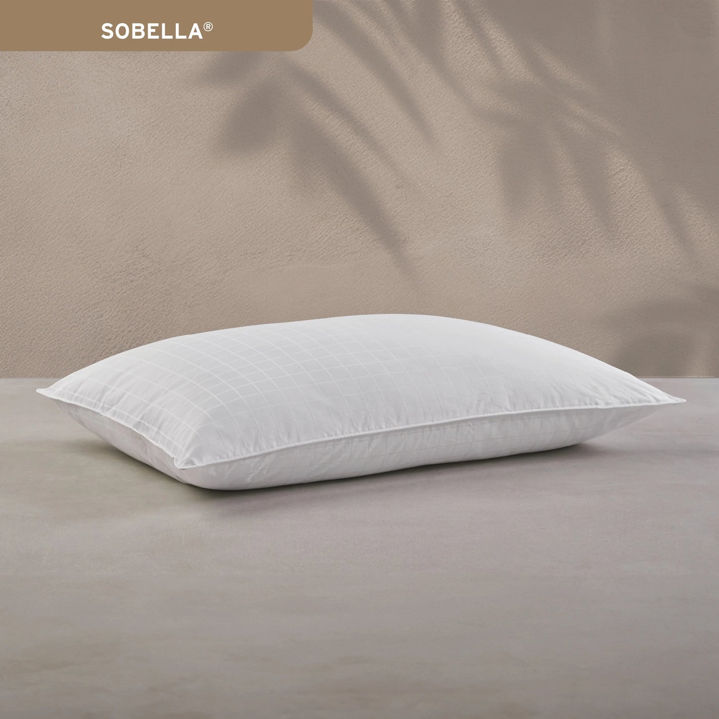 Hotel Sobella hypoallergenic pillow with plush gel fiber and a stylish geometric cotton cover.