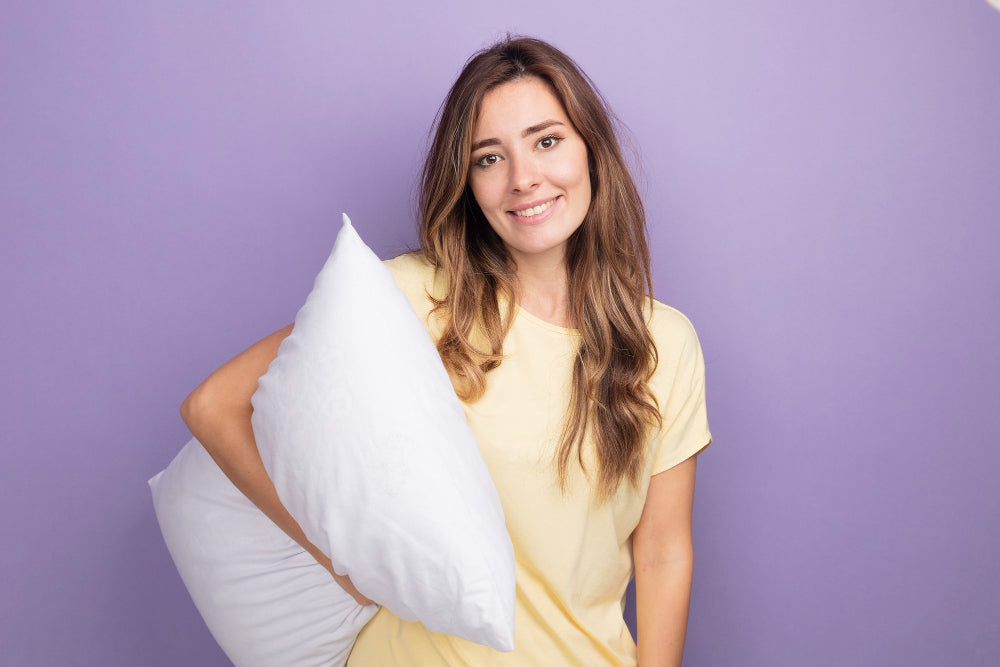 http://hotelhomepillows.com/cdn/shop/files/young-beautiful-woman-beige-t-shirt-holding-white-pillow-looking-camera-with-smile-face-standing-purple.jpg?v=1695969437