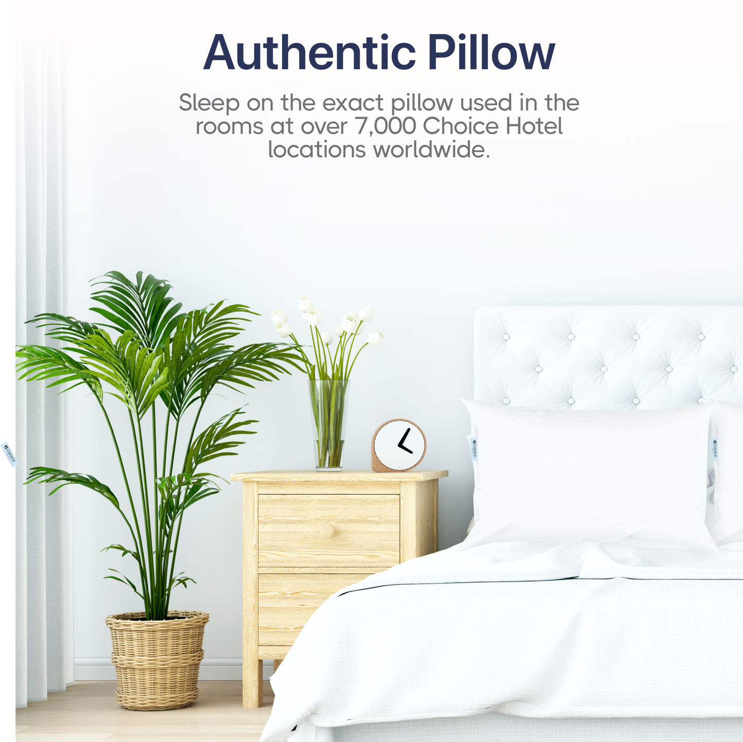 Authentic pillow used in Choice Hotels, showcased on a bed alongside greenery and a bedside clock.