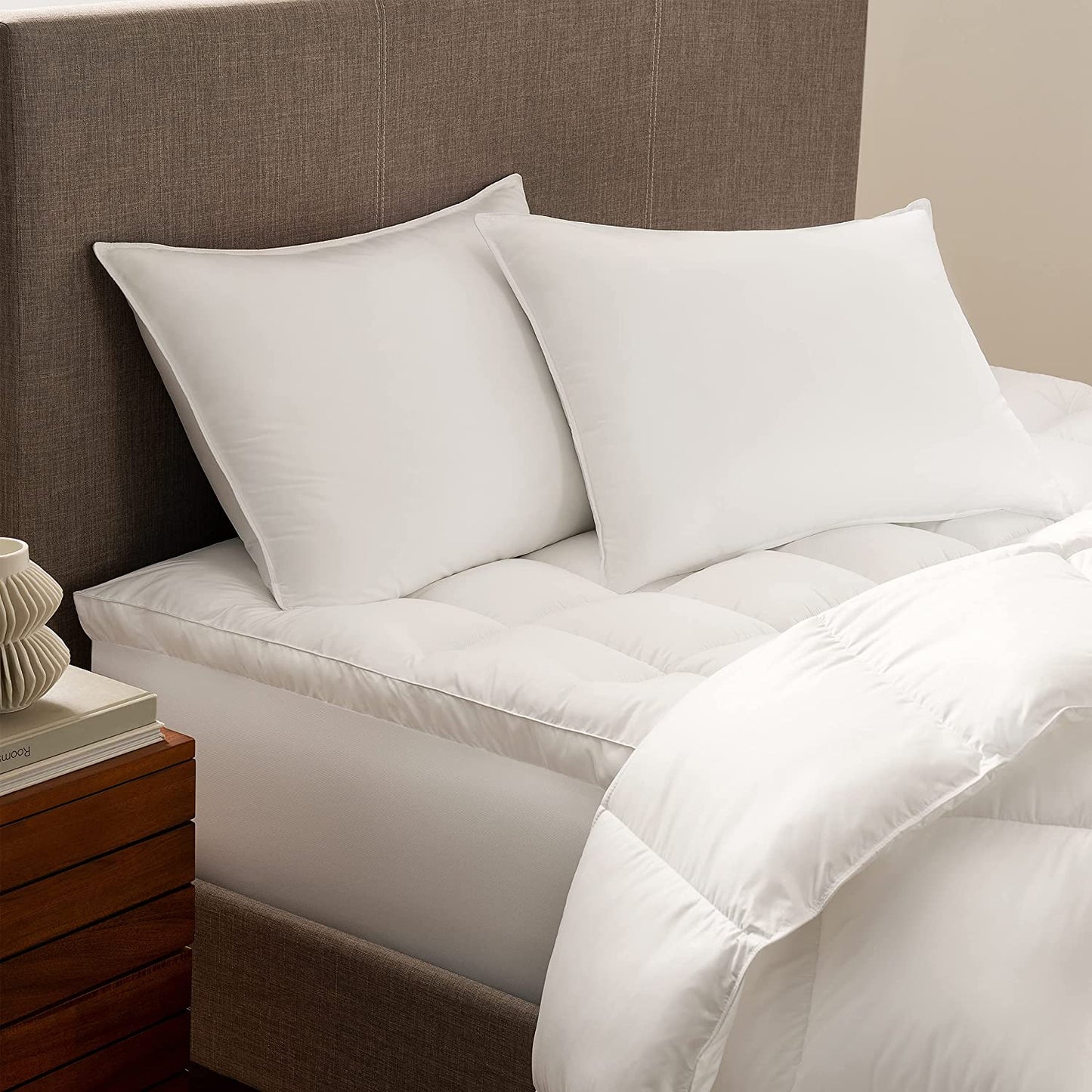 Down Dreams Duck Feather Pillow set on a stylish bed, featuring soft, all-natural materials for comfort and support.