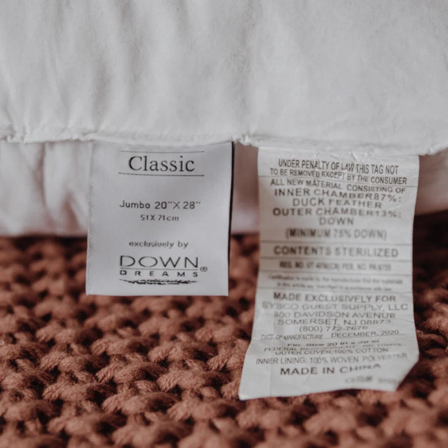 Down Dreams Classic pillow label showing size and materials for premium comfort and support.