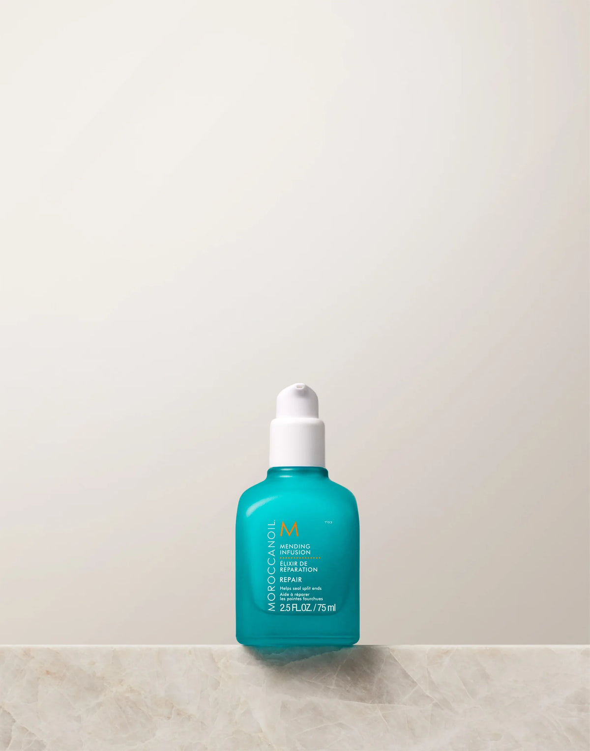 Turquoise Moroccanoil Mending Infusion 75 ml bottle with white cap