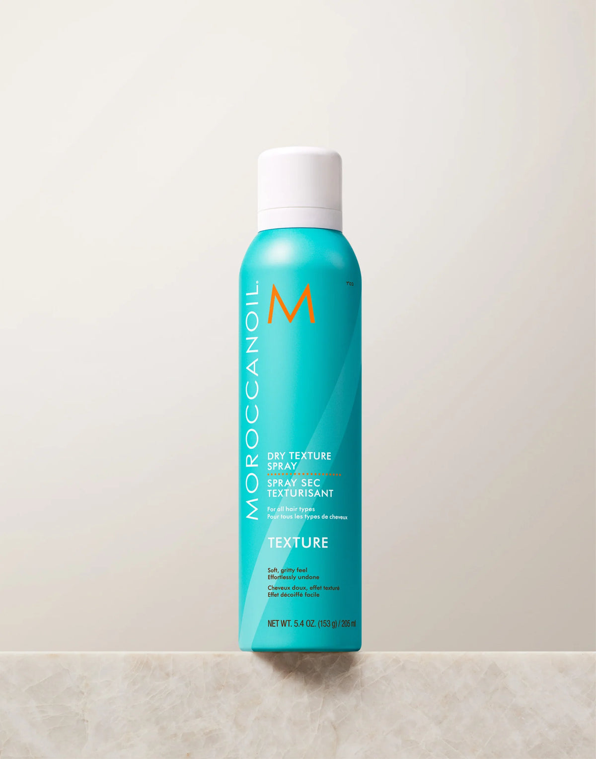 Turquoise Moroccanoil Dry Texture Spray aerosol can with white cap