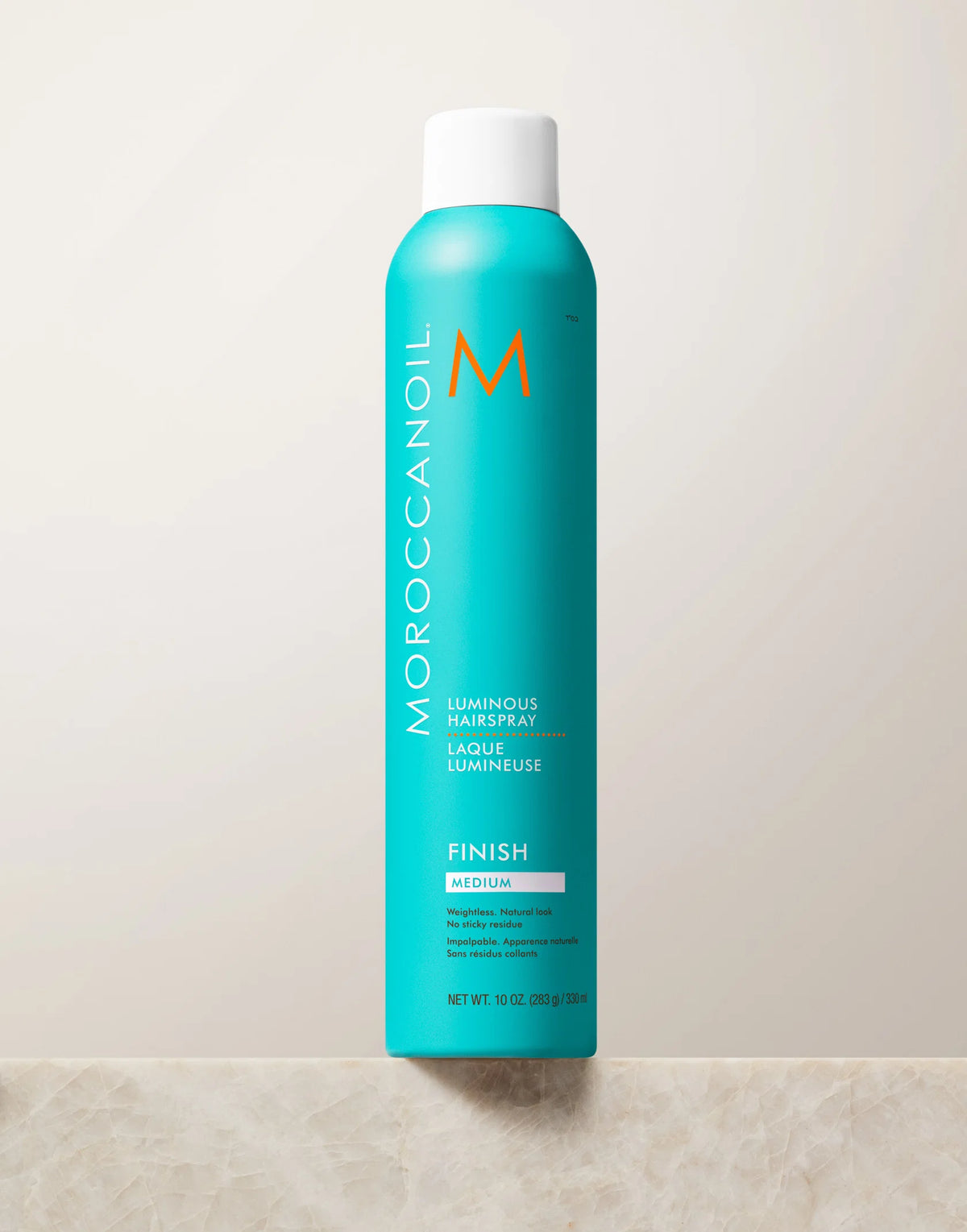 Turquoise Moroccanoil Luminous Hairspray Medium Hold aerosol can with white cap