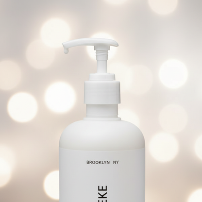 Apotheke Canvas Body Lotion close-up pump detail — luxury white minimalist packaging plant-based hotel lotion