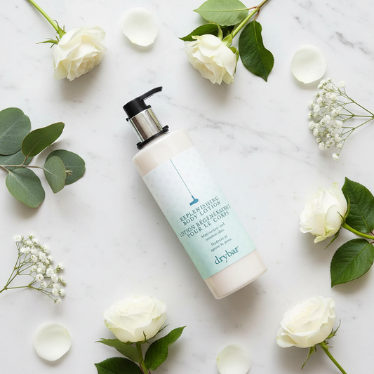 Drybar Replenishing Body Lotion flat lay on marble — luxury hotel body lotion paraben-free