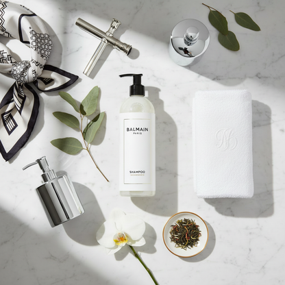 Balmain Paris Shampoo - luxury hotel shampoo on marble flat lay with Parisian styling