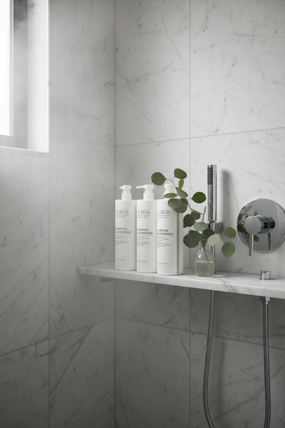 Zero% Naturally Kind Shampoo in luxury hotel shower scene