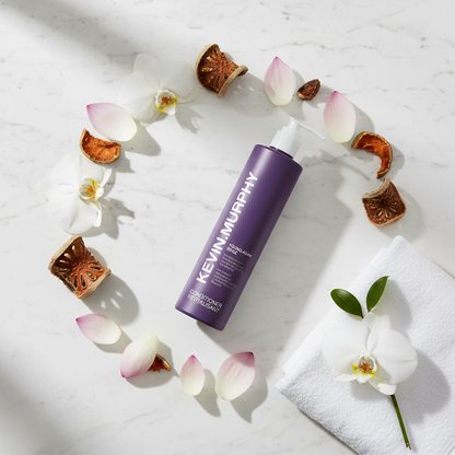 Kevin Murphy Young.Again Conditioner - circular flat lay with orchid, baobab, lotus on marble