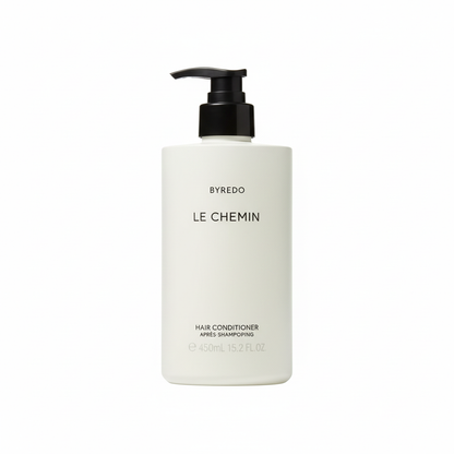 Byredo Le Chemin Conditioner bottle close-up Swedish luxury hair care packaging label details floral fragrance
