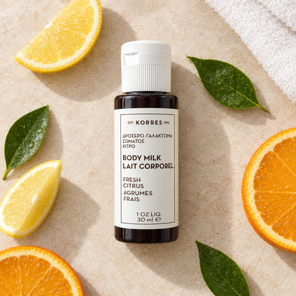 Korres body milk flat lay with citrus elements