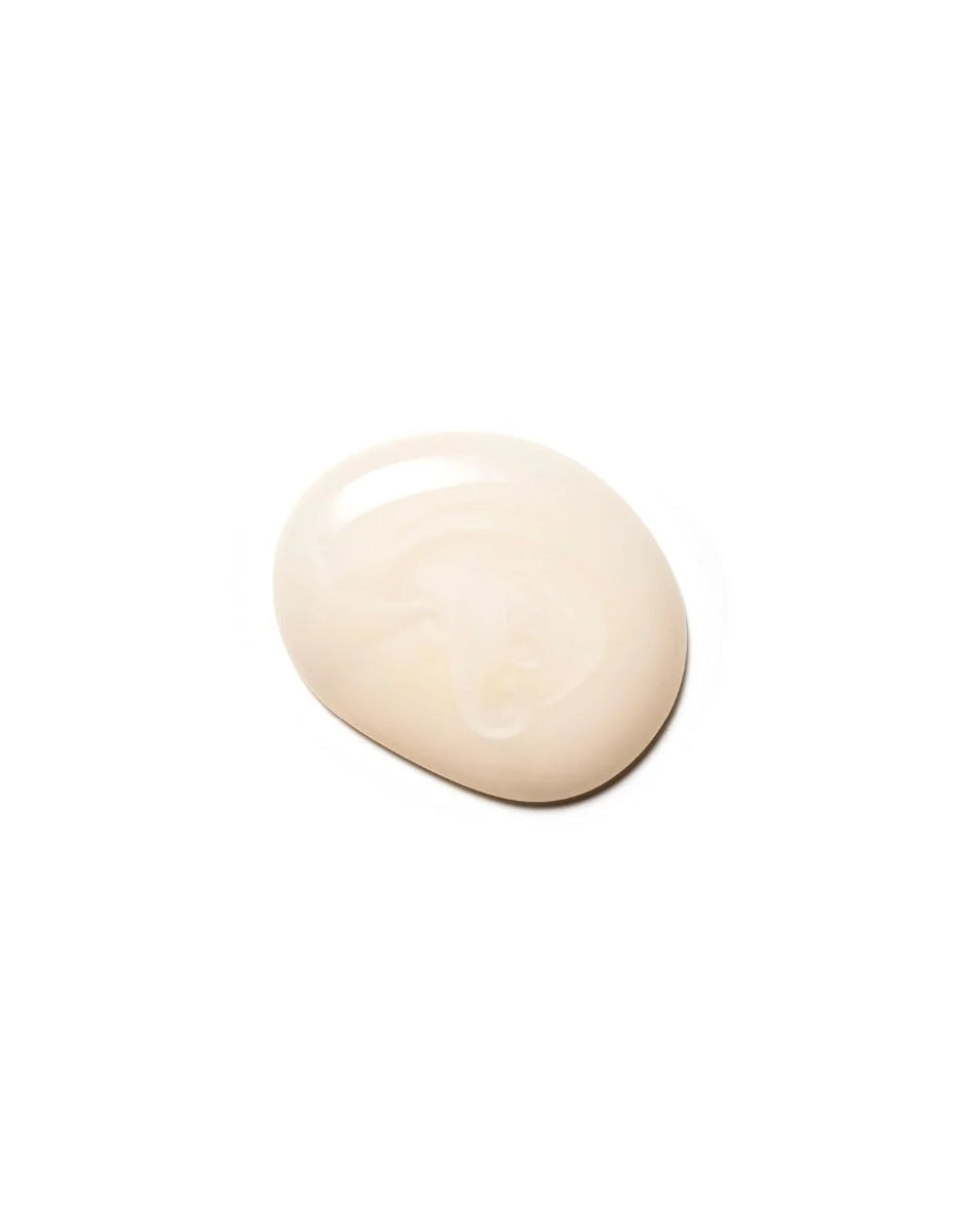 Close-up of a small dollop of Moroccanoil Moisture Repair Shampoo on a white background, showing the product texture.