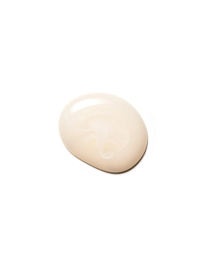 Close-up of a small dollop of Moroccanoil Moisture Repair Shampoo on a white background, showing the product texture.